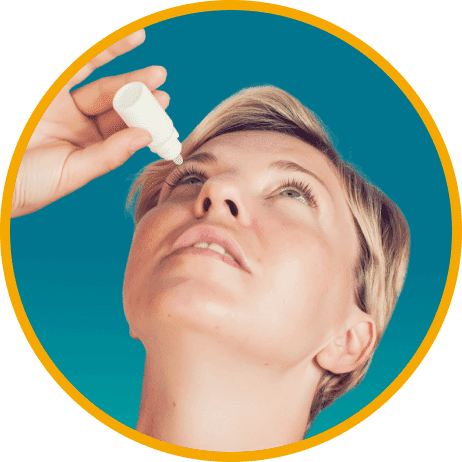 Woman applying eye drops