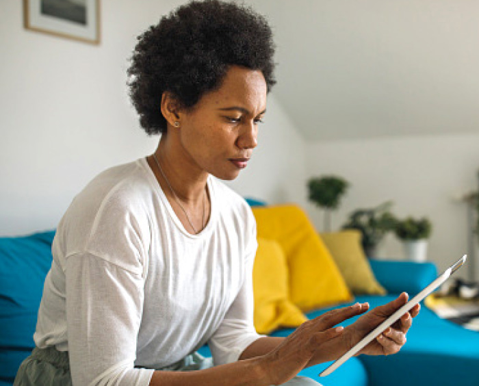 Woman using a tablet.